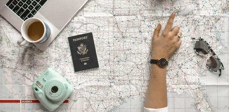 Traveller using Google Maps and Maps.me on a smartphone to plan a route, showing offline map navigation for international travel.