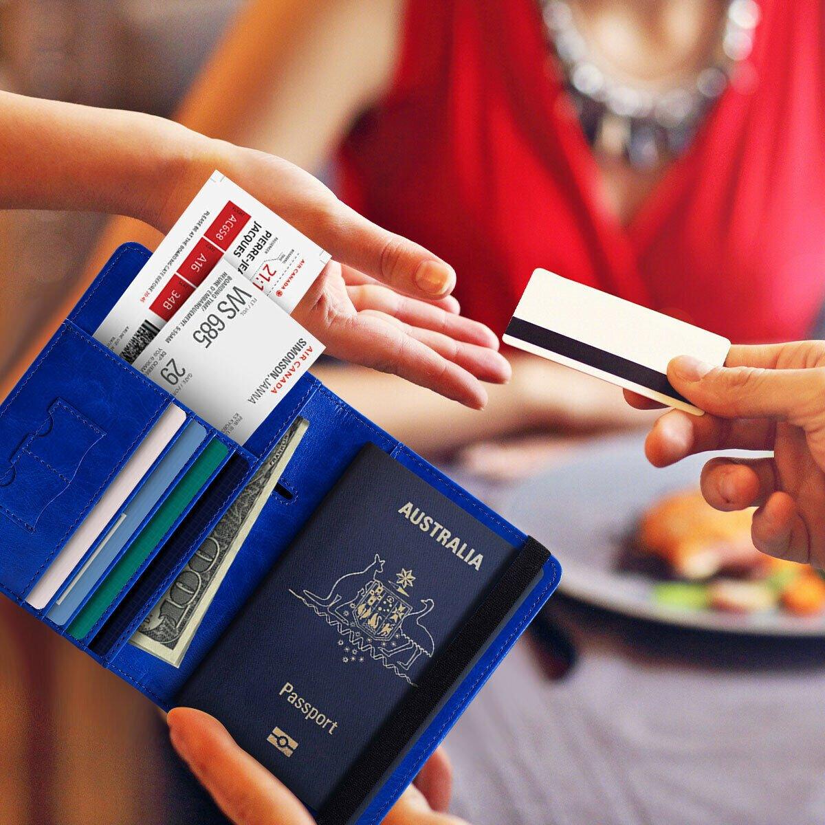 Australian traveller holding an RFID blocking wallet at a contactless payment terminal, protecting cards from skimming.