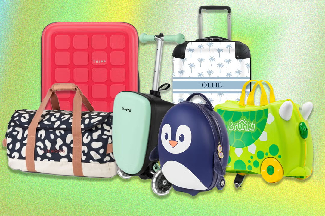 Child pulling a colourful hardshell kids carry-on suitcase through an airport terminal, showing spinner wheels and TSA-approved lock.
