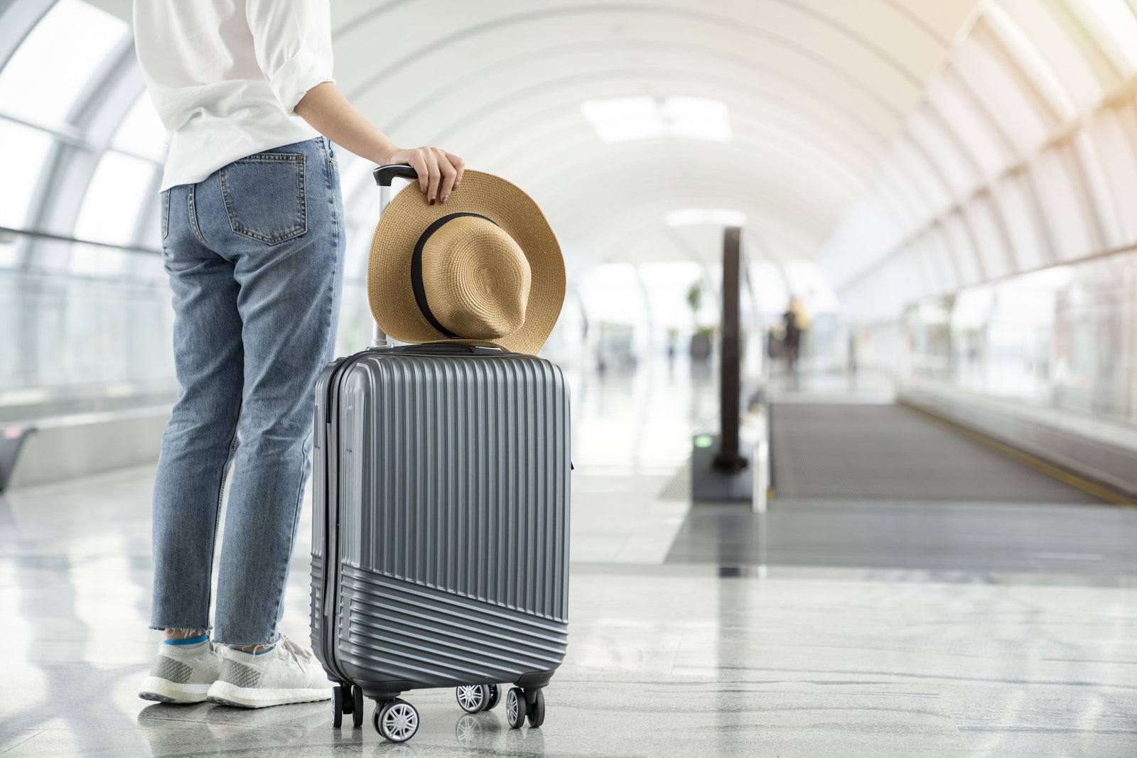 Range of travel luggage including hardshell suitcase, carry-on backpack and duffel bag laid out for comparison, suitable for Australian travellers.