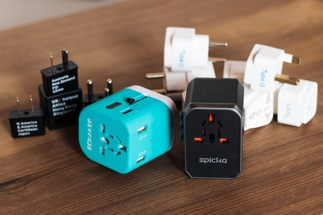 Universal travel charger with USB-A and USB-C ports and international plug adaptors, suitable for Australian travellers heading overseas.