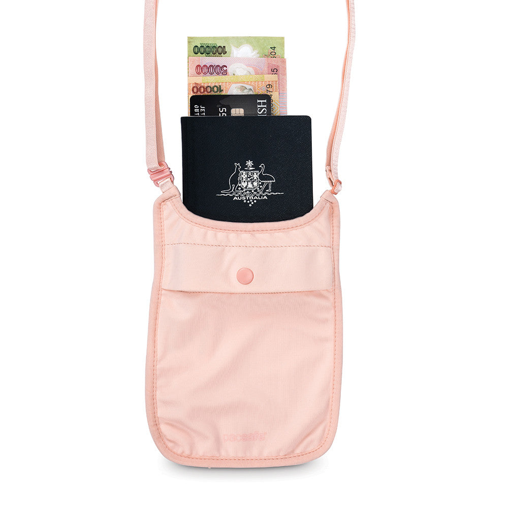 Orchid pink Pacsafe Coversafe S75 packed with passport cash and cards