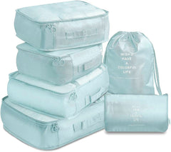 Light blue waterproof compression packing cubes set for organising clothes and accessories